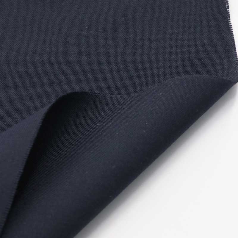 Navy aramid-13 woven fabric for turnout gear outer shells, twill weave, on a white background